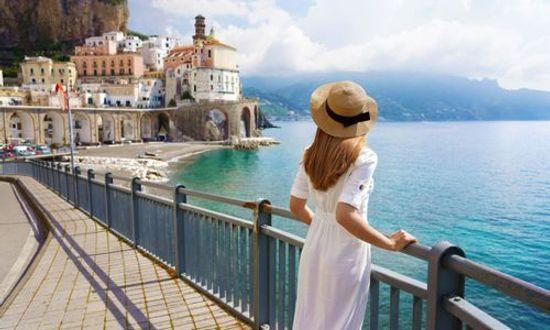 Back view of a women enjoying view of Atrani village on Amalfi Coast